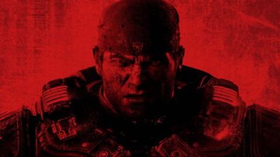 Close-up of a battle-worn soldier in tactical gear, with a fierce glare and a red color filter.