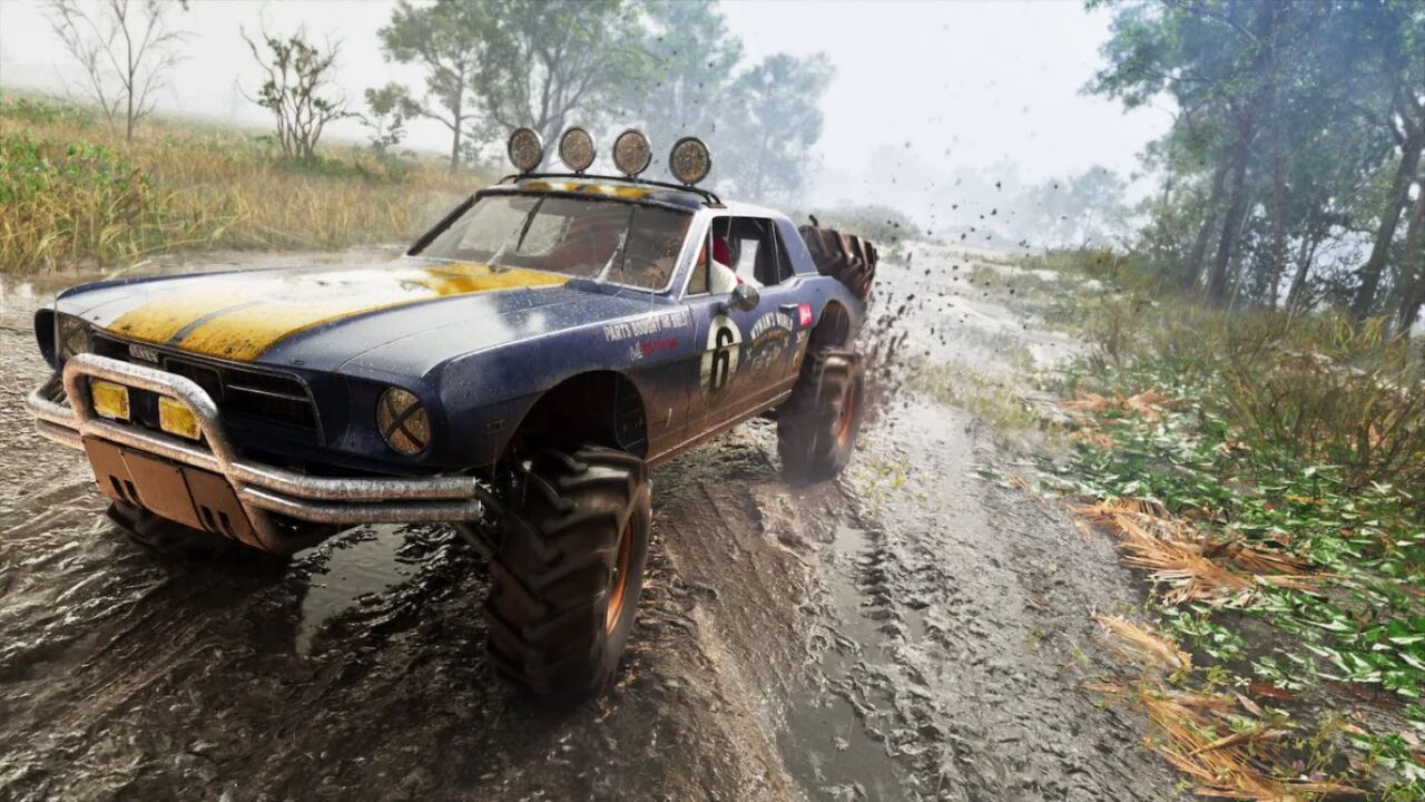 Blue Vintage Rally Car Kicking Up Mud on a Wet Dirt Road Four wheel Drive with Roof Lights and Number 6 Racing Through a Muddy Wooded Landscape