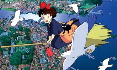 Young girl with a red bow riding a broom over a coastal town, with a black cat in an orange bag nearby.