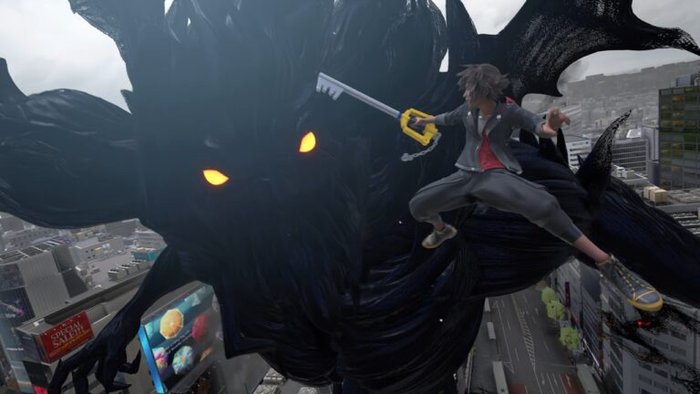Sora fights a giant dark creature in midair above a city, wielding a large keyblade on a windy rooftop chase.