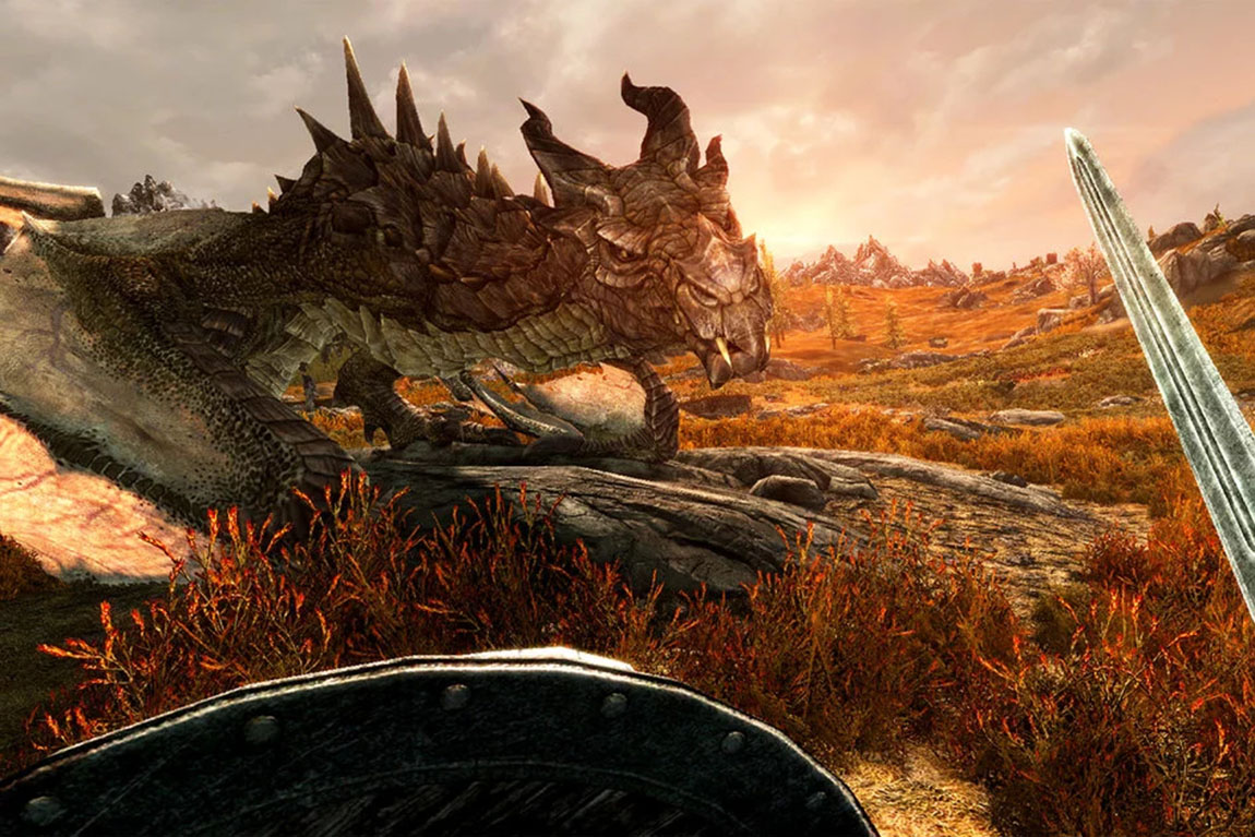 Skyrim 6a2qyujbxf First person View of a Dragon on a Rocky Sunset lit Plain with a Shield at the Bottom and a Sword Visible on the Right Edge
