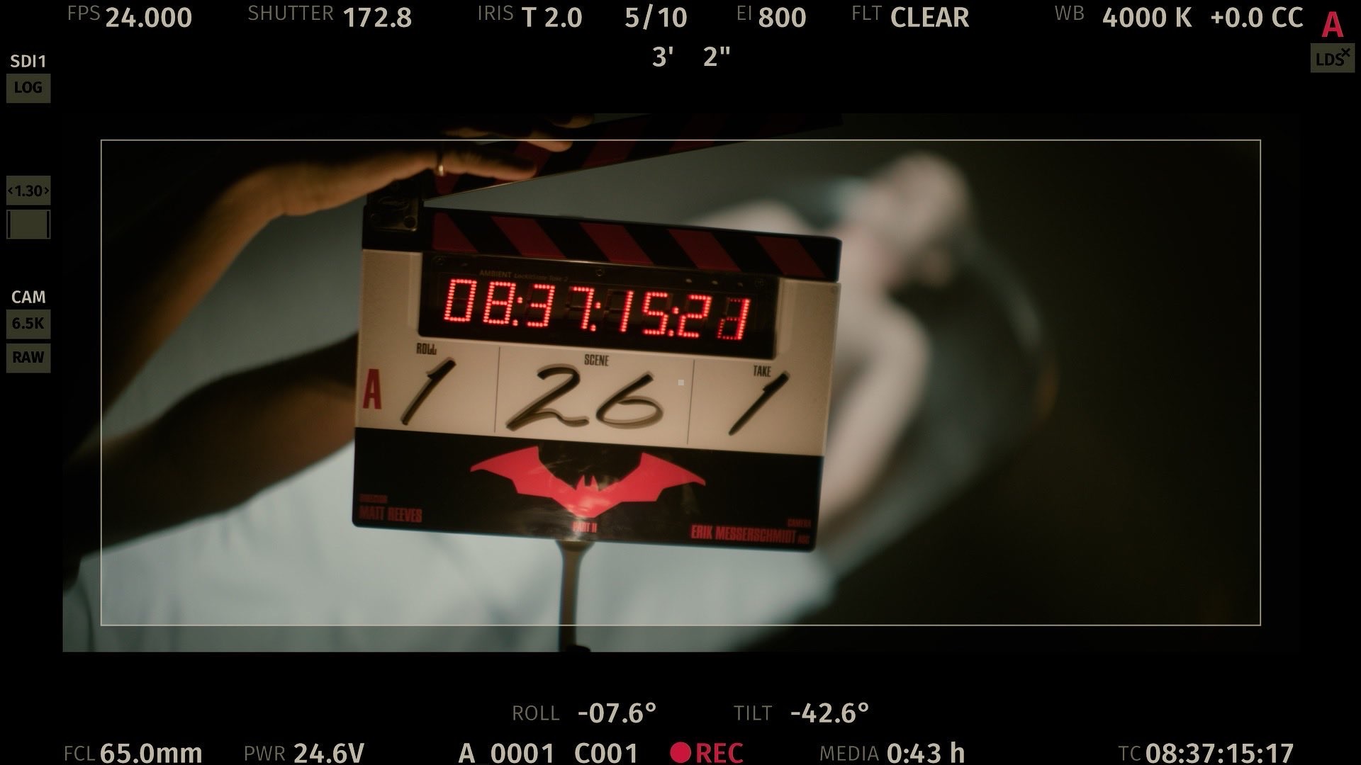 the Batman 2 Has Finally Begun Filming Clapperboard Held by a Crew Member with a Red Digital Timer Reading 08371521 Scene A1261 Batman Logo Visible on the Board