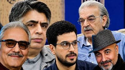 Group of five men posing closely for a selfie, smiling and looking at the camera.