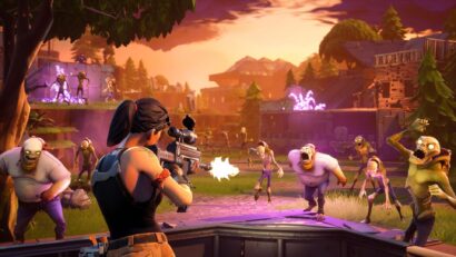 Fortnite battle scene: a player with a rifle fires at a horde of zombies as sunset lights up the battlefield behind destroyed structures.