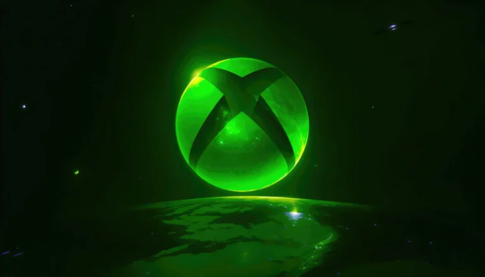 Green glowing spherical sculpture with crisscrossing bands against a dark space-like background.