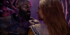 Close-up of a bearded, scarred man in armor facing a blonde woman in ornate armor in a tense, purple-lit fantasy setting.